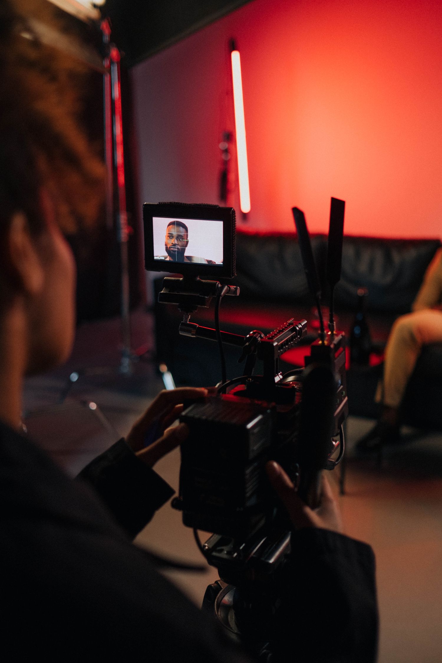 Film crew operating a cinema camera on set