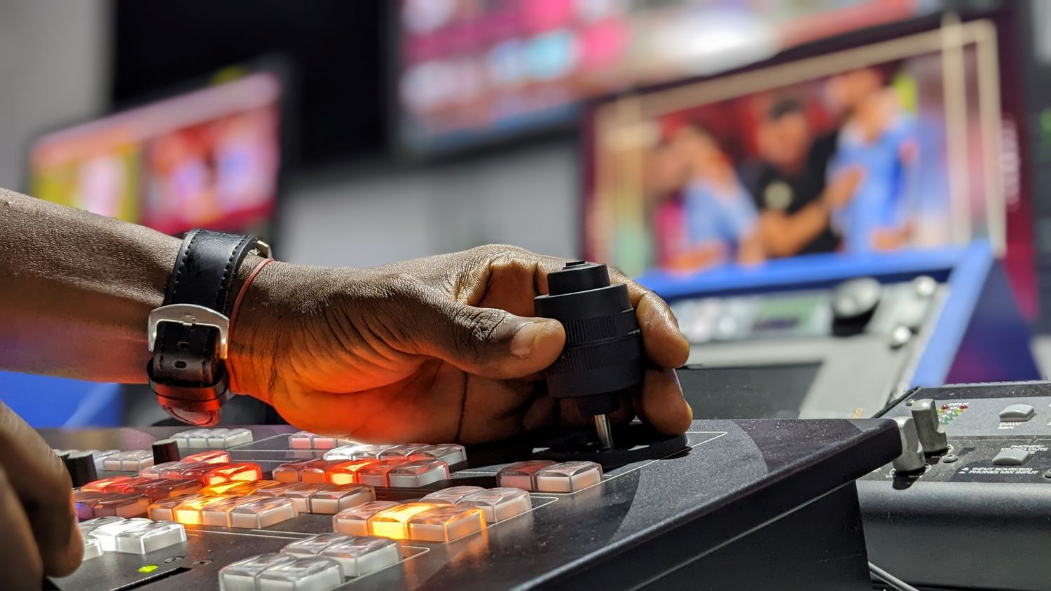 Operator using a live broadcast mixer